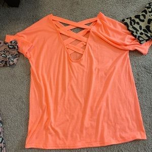 Boutique top, photo is of back of shirt, neon